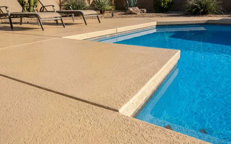 Cool Deck pool surround with acrylic-cement overlay