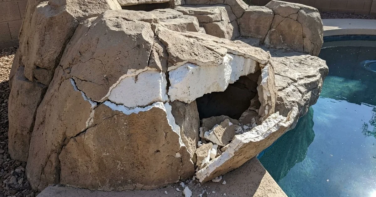 Foam-core waterfall before repair with exposed foam