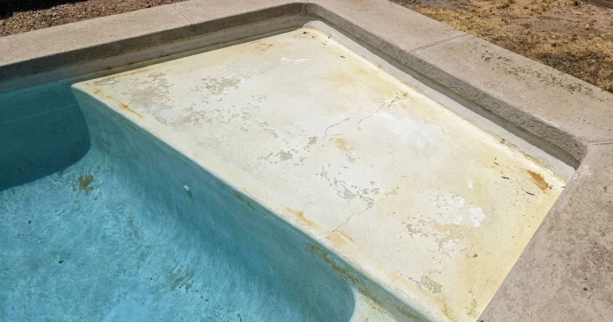 Phoenix pool with aging white plaster showing etching